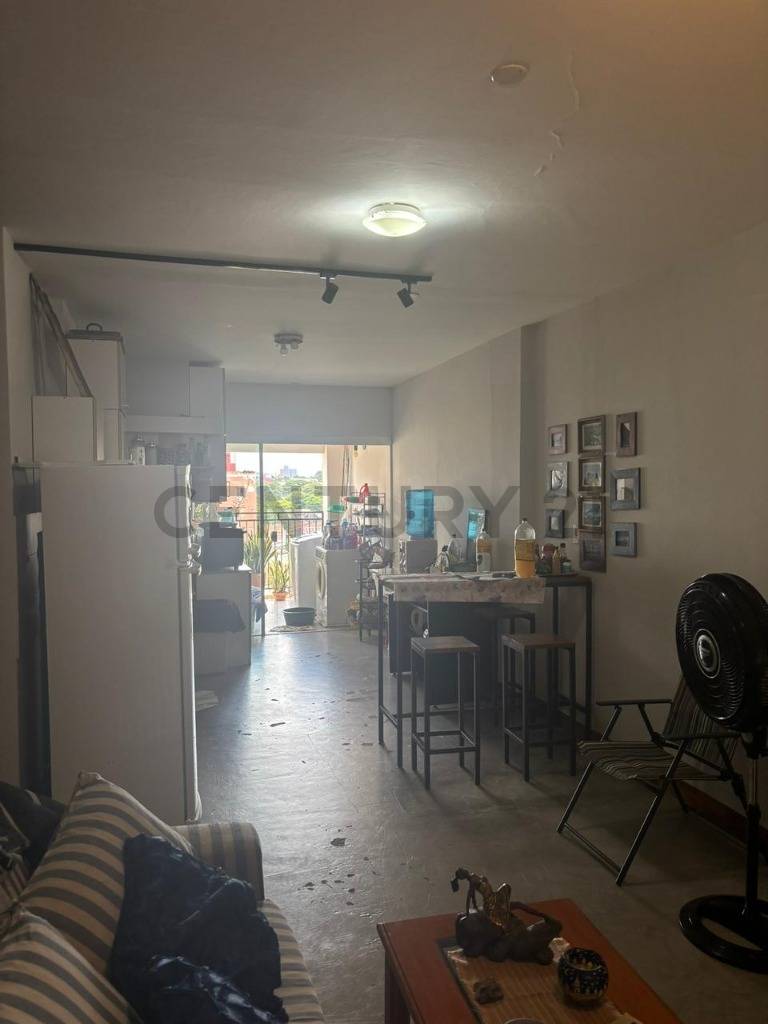 Living and dining room with open kitchen and balcony
